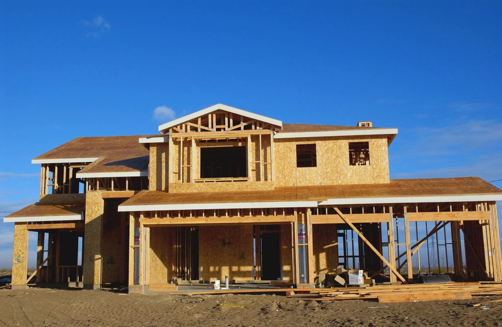 A house under construction with the roof up.